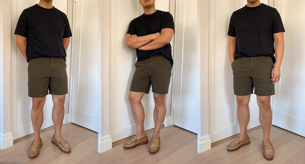 A man in a black Olivers T-shirt and dark green shorts