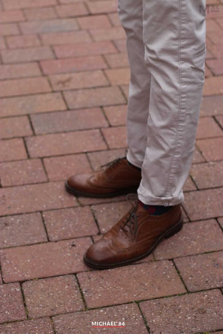 Outfit of beige chinos and brown brogues