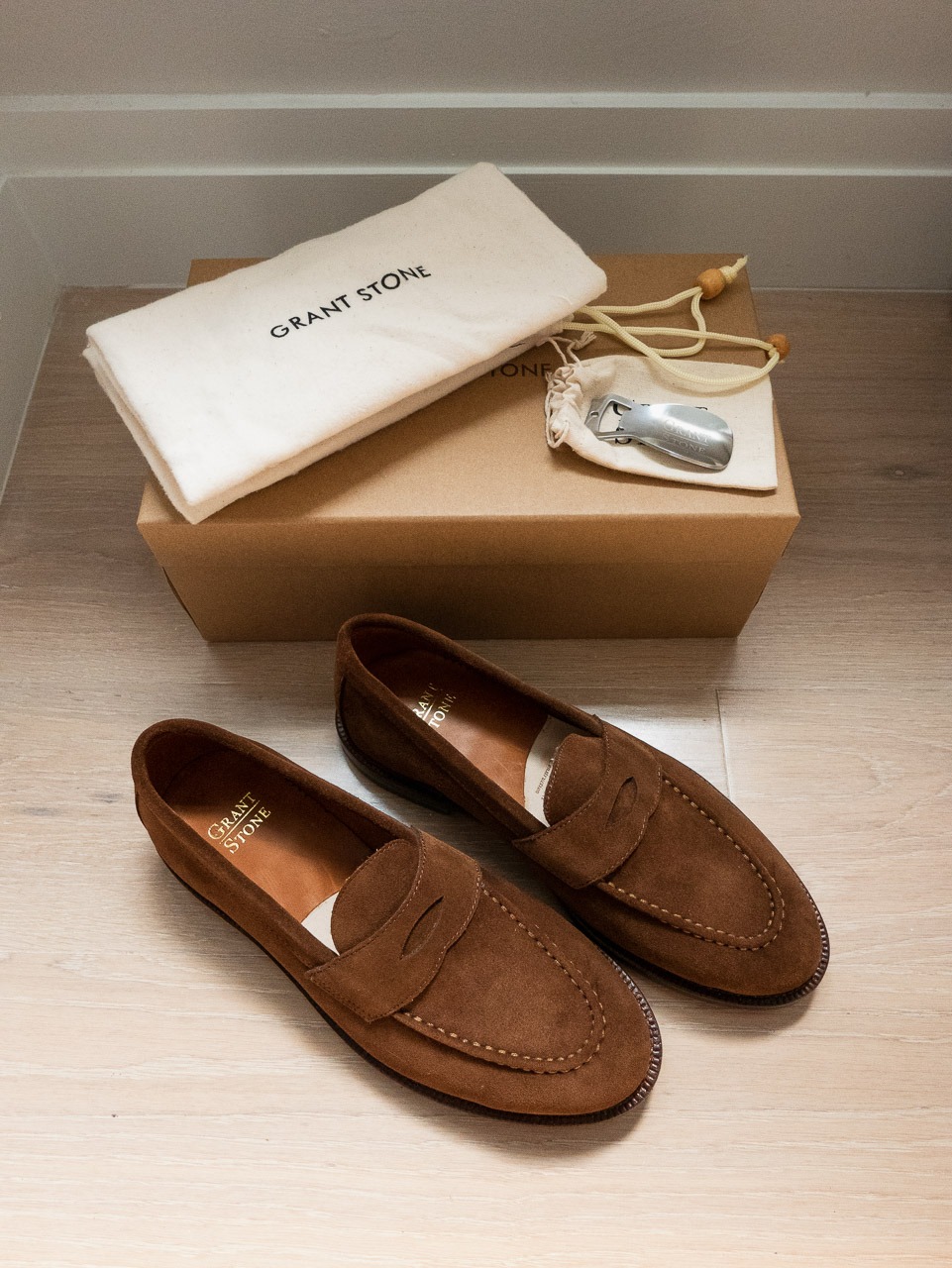 grant stone shoebox with shoe bags and brown suede loafers
