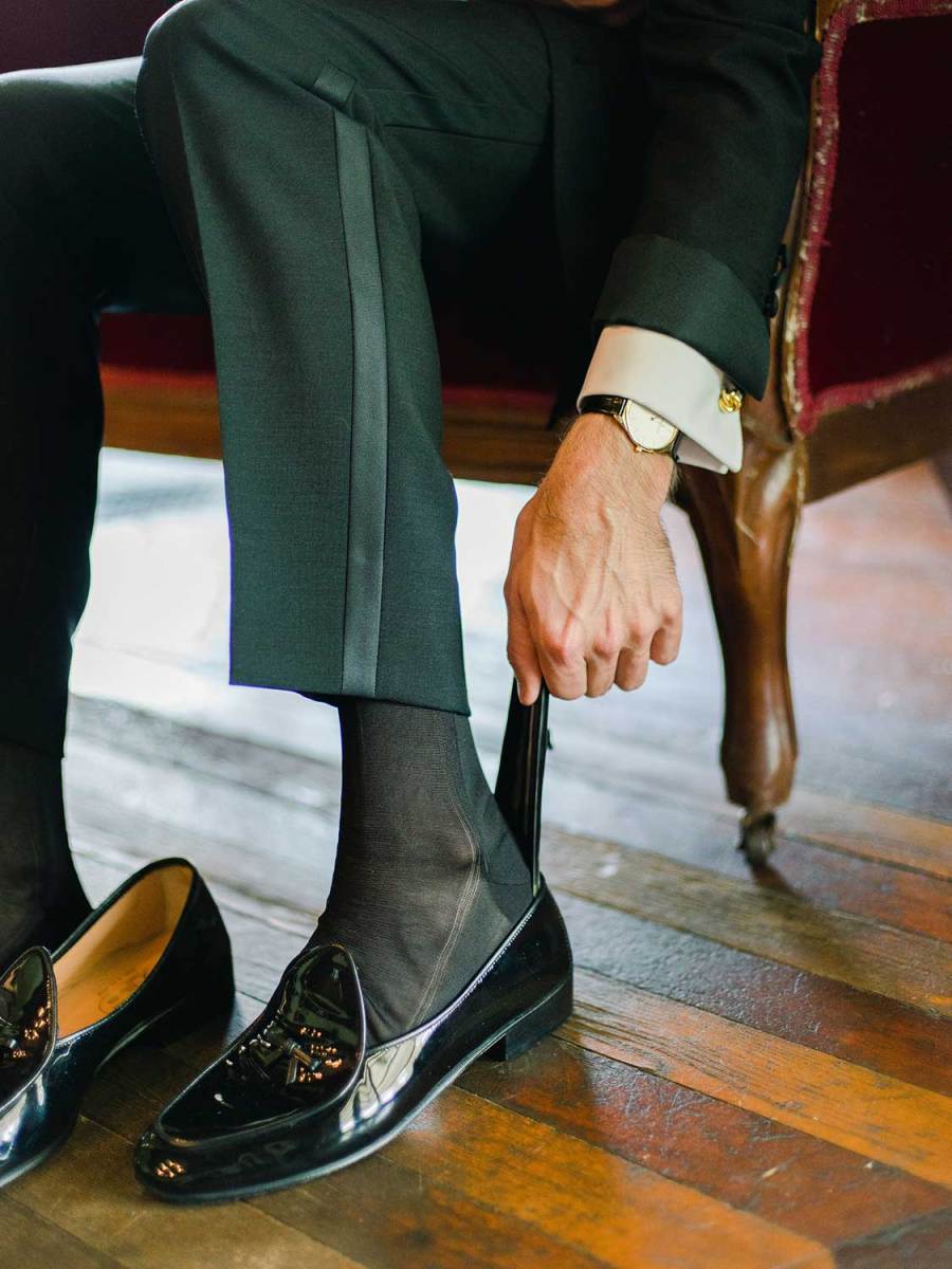 A tuxedo with black silk socks is the most classic choice.