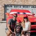 Posing for a photo with a Lightning McQueen impersonator at a Disney Pixar Cars-themed birthday