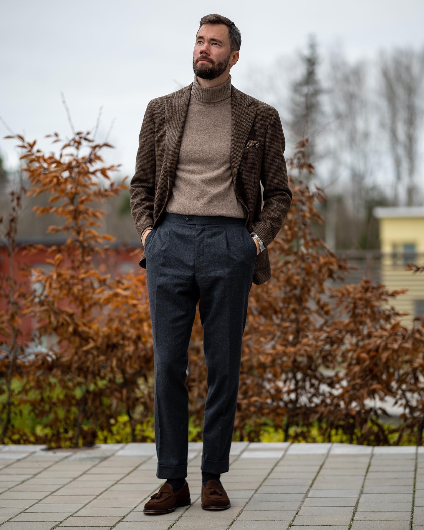 Man wearing turtleneck styled with pants and coat