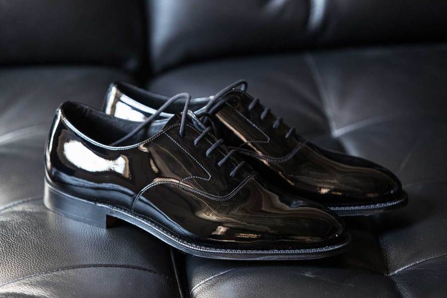 Patent leather oxford shoes are a classic style of formal footwear with a tuxedo.
