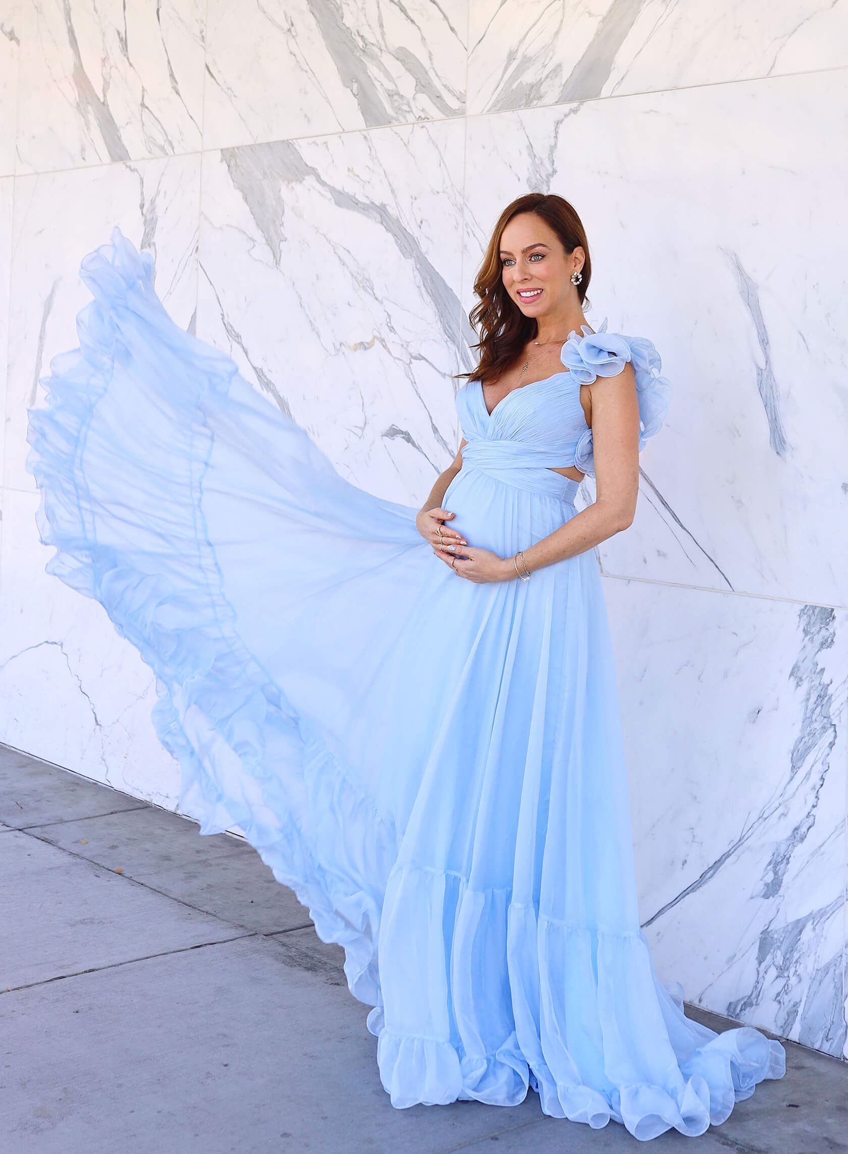 Sydne-Style-shows-what-to-wear-for-a-gender-reveal-in-Mac-Duggal-blue-dress.jpg